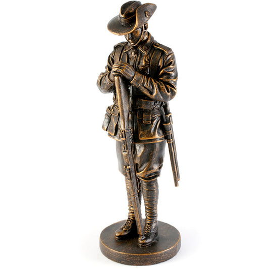 This exceptional Master Creations miniature figurine of a lone digger standing, Resting on Reversed Arms, the traditional position of respect for the fallen shares service, sacrifice and our promise to remember. The beautiful cold cast bronze figurine is approximately 200mm high with a 70mm round base.