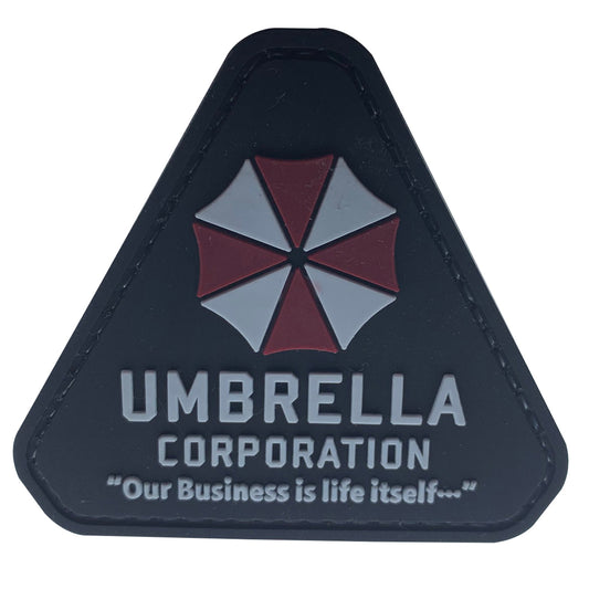 Umbrella Corporation PVC Patch, Velcro backed Badge. Great for attaching to your field gear, jackets, shirts, pants, jeans, hats or even create your own patch board.  Size: 7.2x6.5cm  VELCRO BACKED